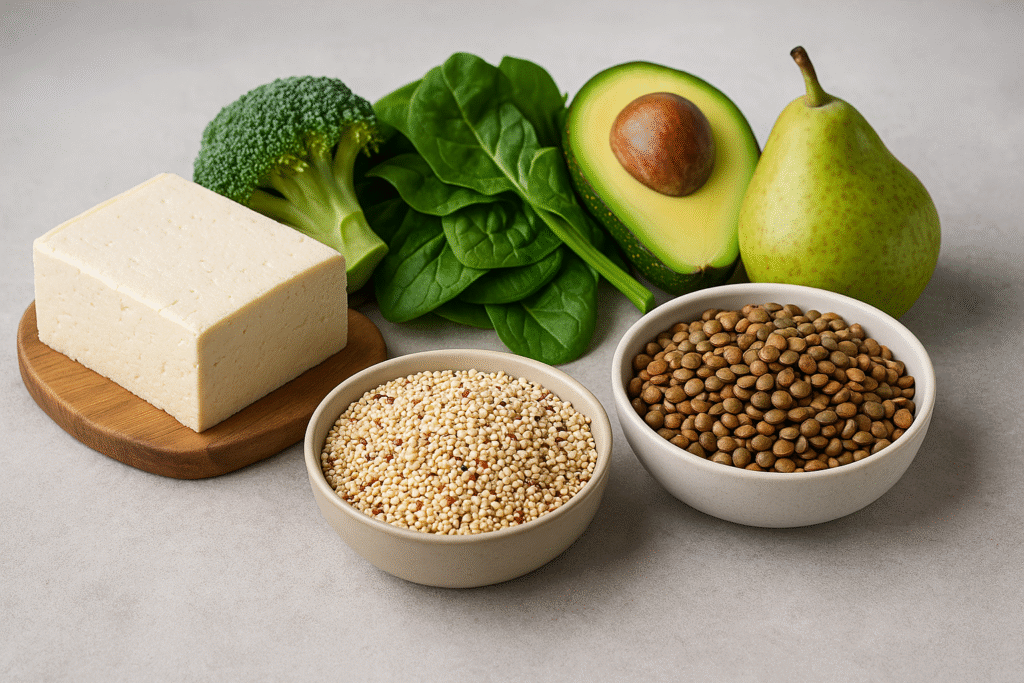 Horizontal photo showing ideal foods for blood type B, including spinach, lentils, tofu, avocado, quinoa, and pear